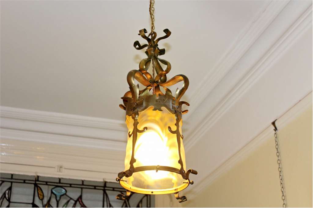 Quality brass arts and crafts lantern with original glass shade possibly by Powell