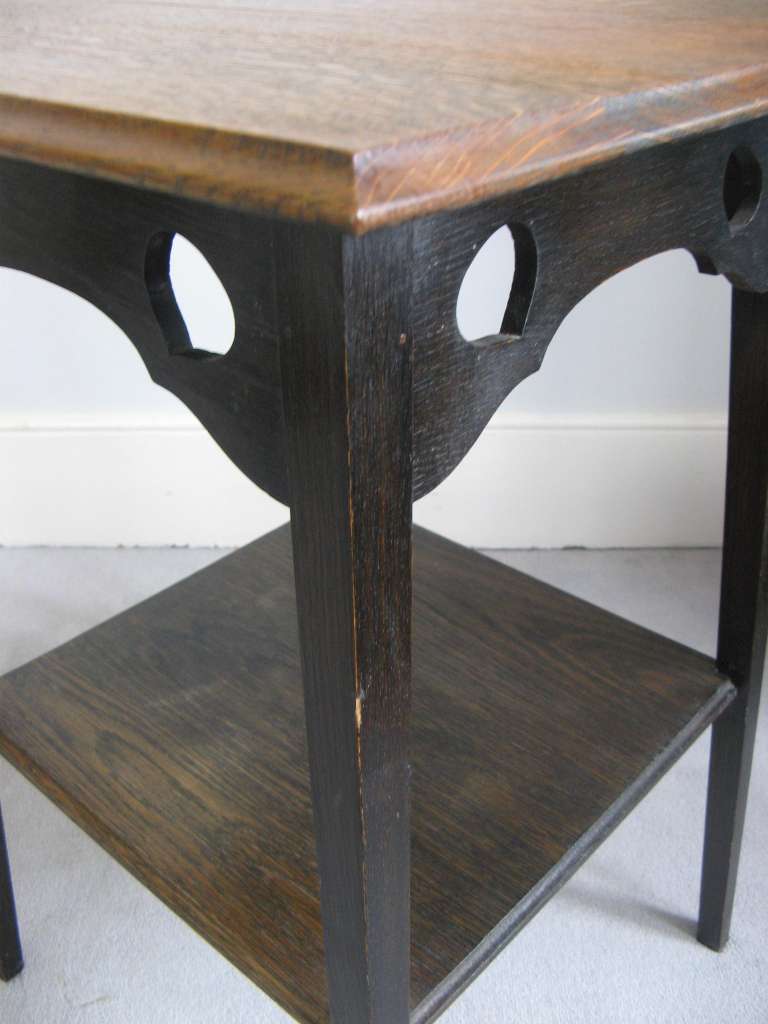 arts and crafts oak side / lamp table with pierced heart decoration