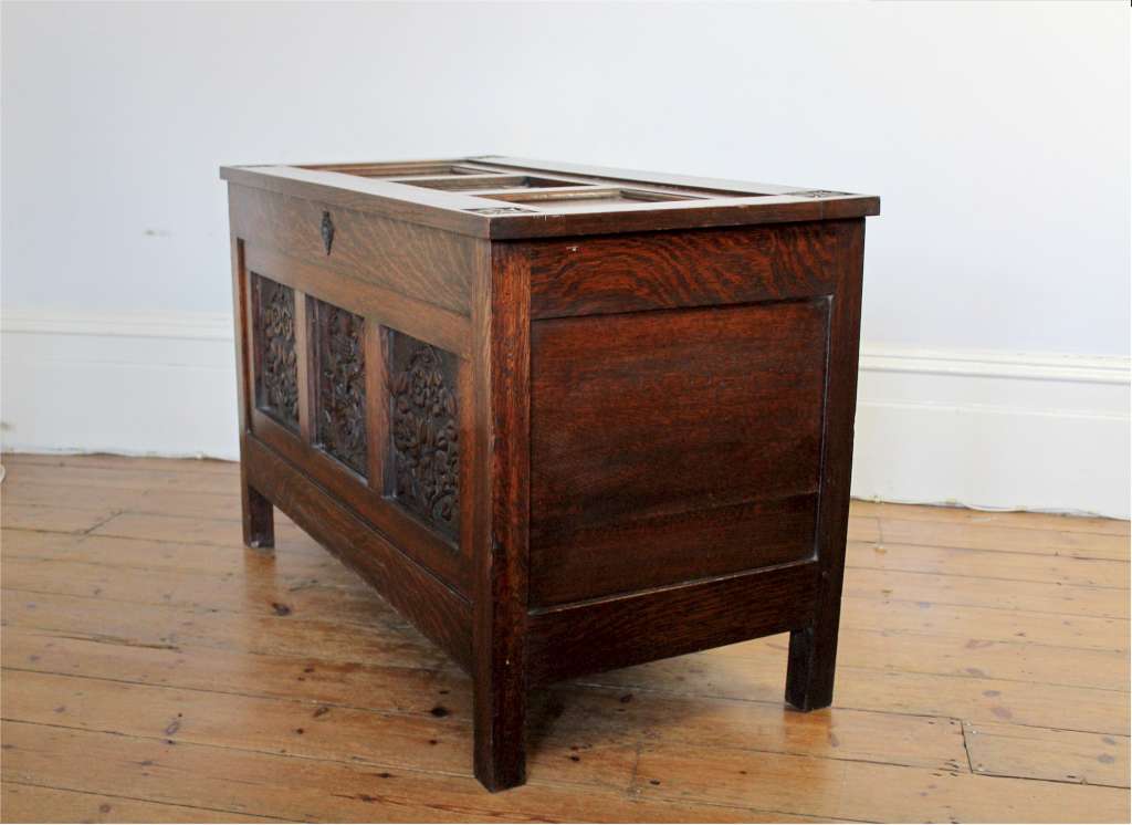 Arts and Crafts oak blanket box with carved panels