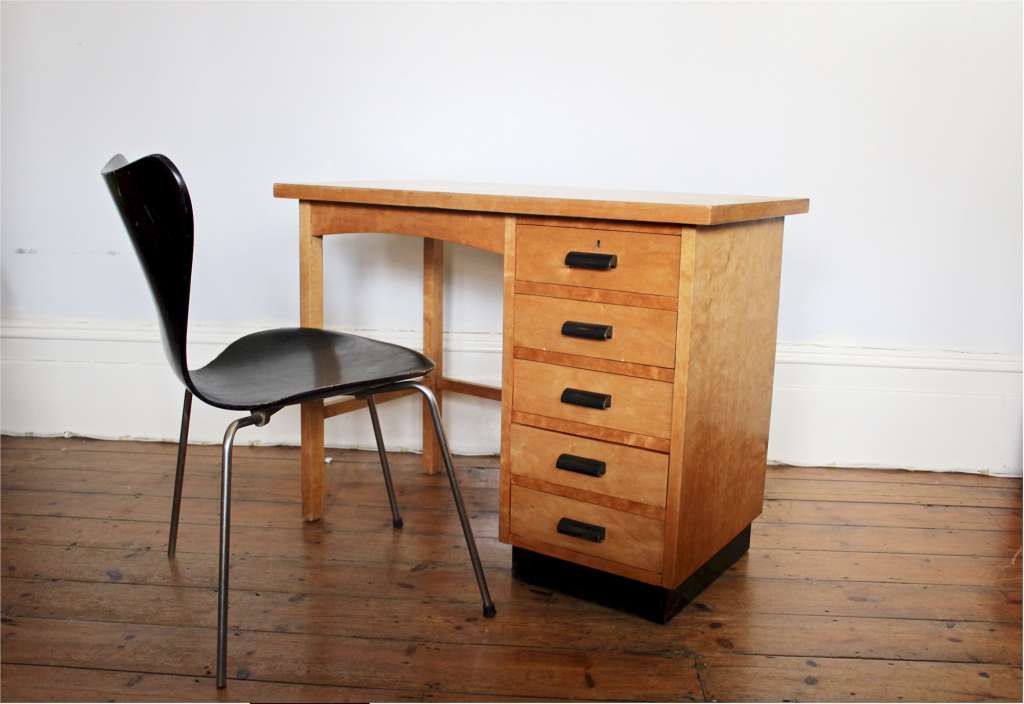 Modernist plywood birch desk with black handles and plinth