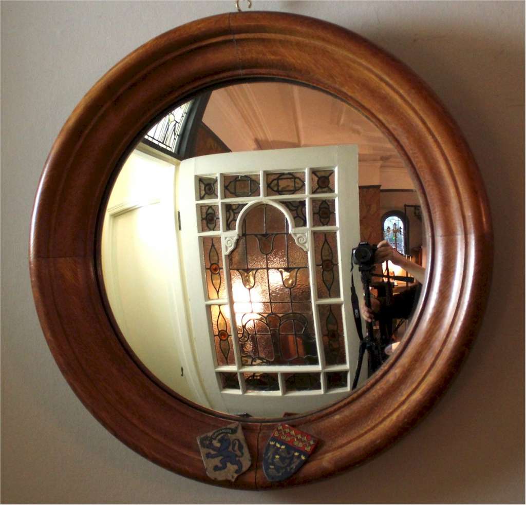 Circular oak framed convex mirror Cambridge University.