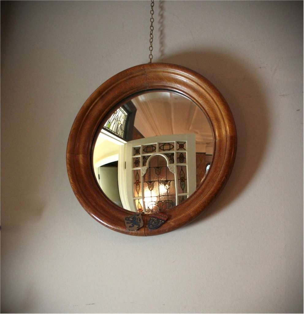 Circular oak framed convex mirror Cambridge University.