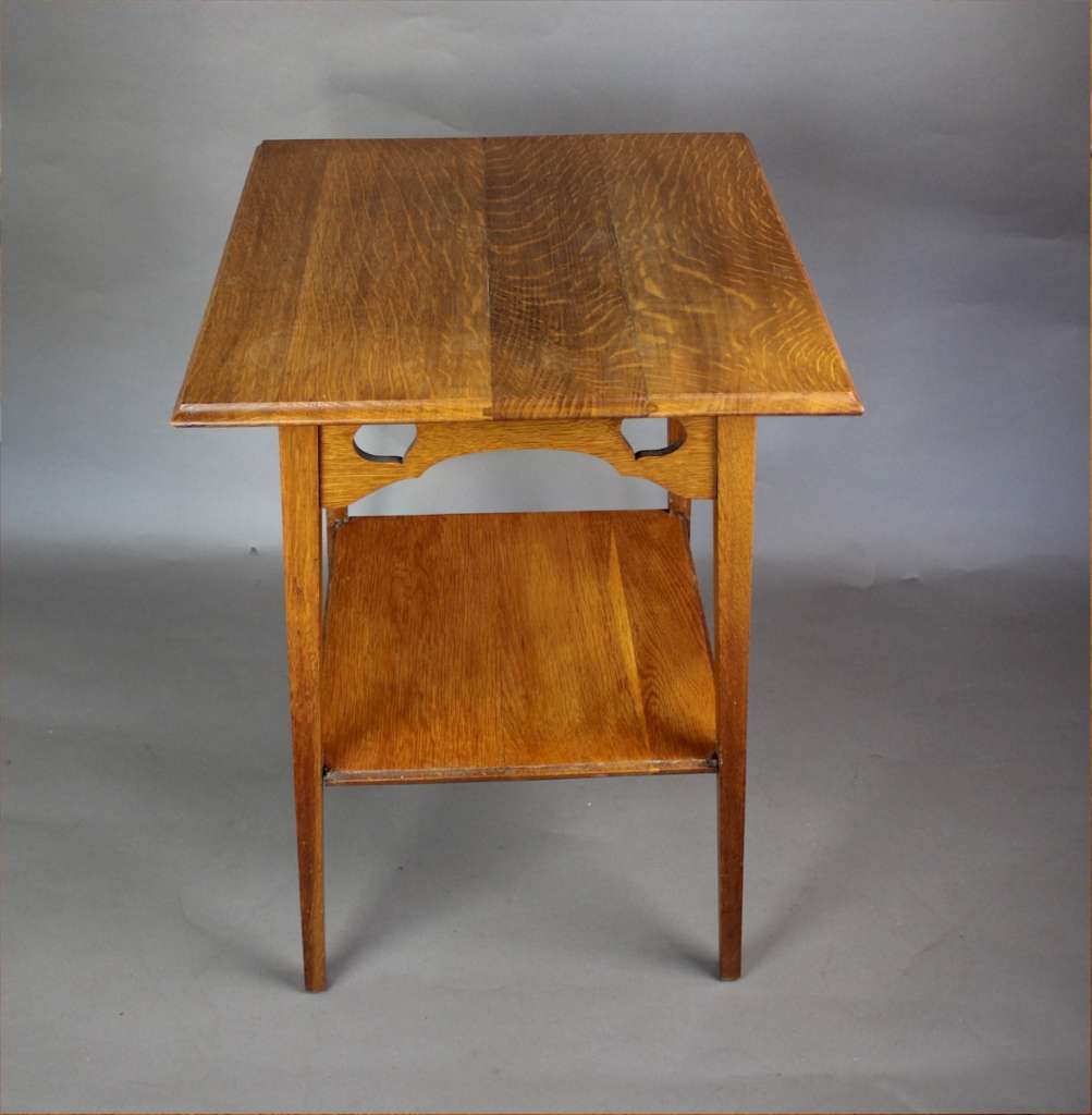 Arts and crafts golden oak heart cut out occasional table. c1900