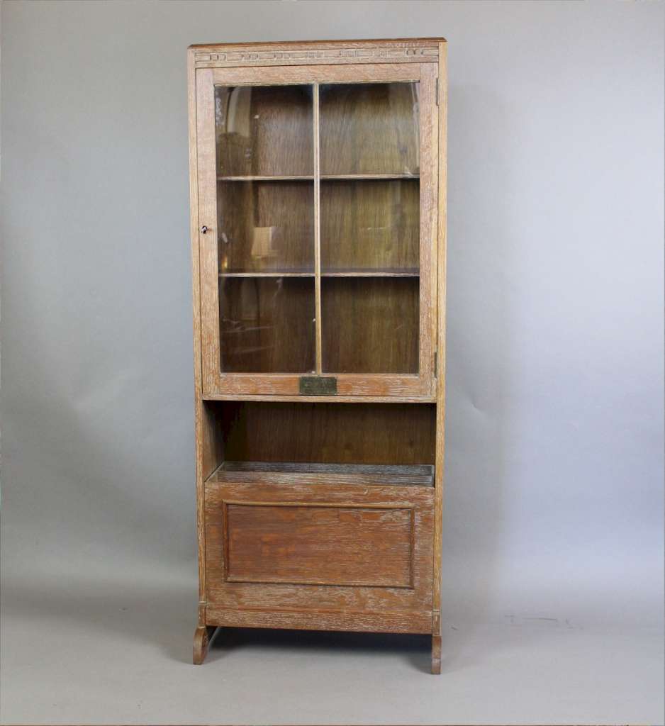 1930's limed oak glazed bookcase with interesting fall front magazine rack. Probably by Heals
