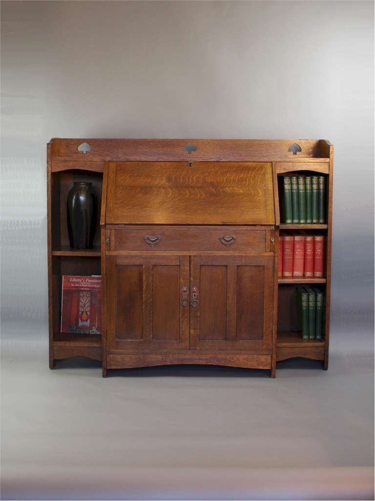 Liberty & Co arts and crafts oak bureau bookcase with pierced heart cut outs