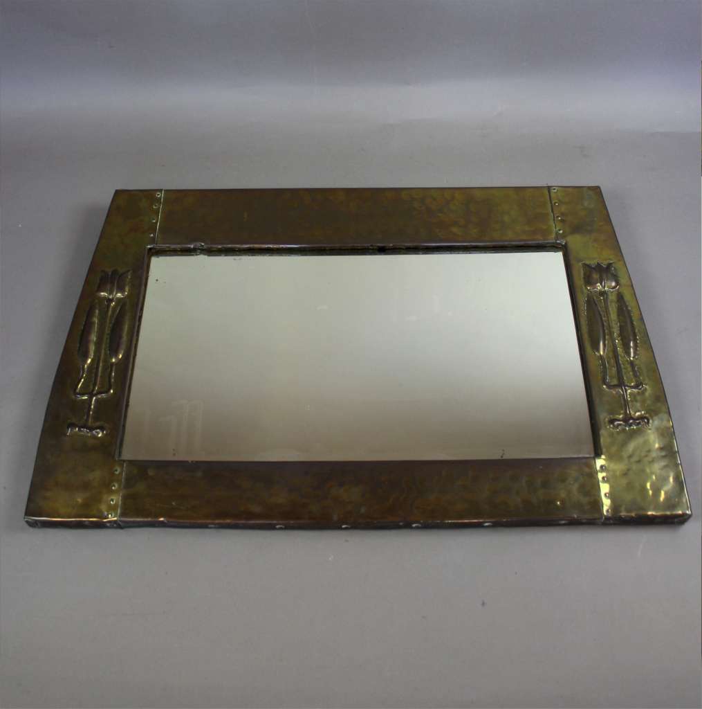 Arts and Crafts / Nouveau brass mirror with raised stylised tulip