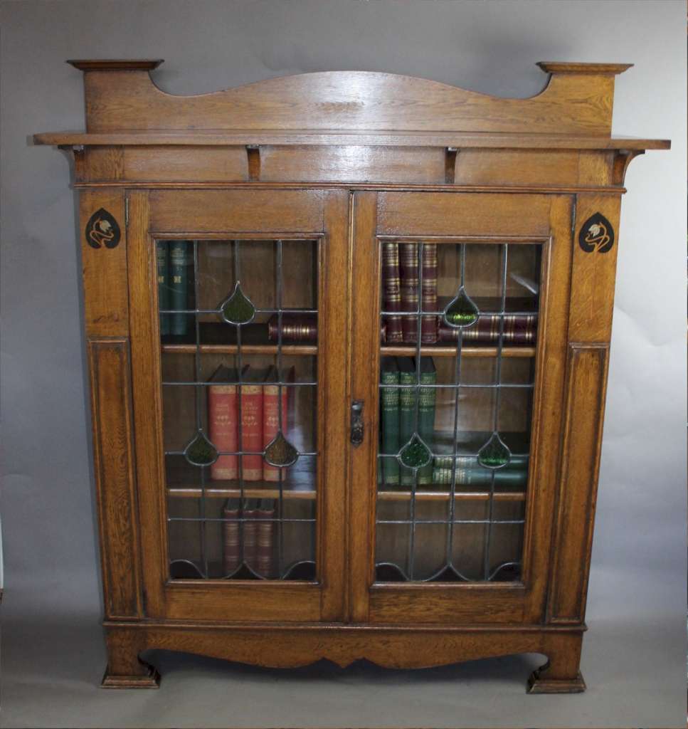 Arts and Crafts oak bookcase with pewter and ebony inlay