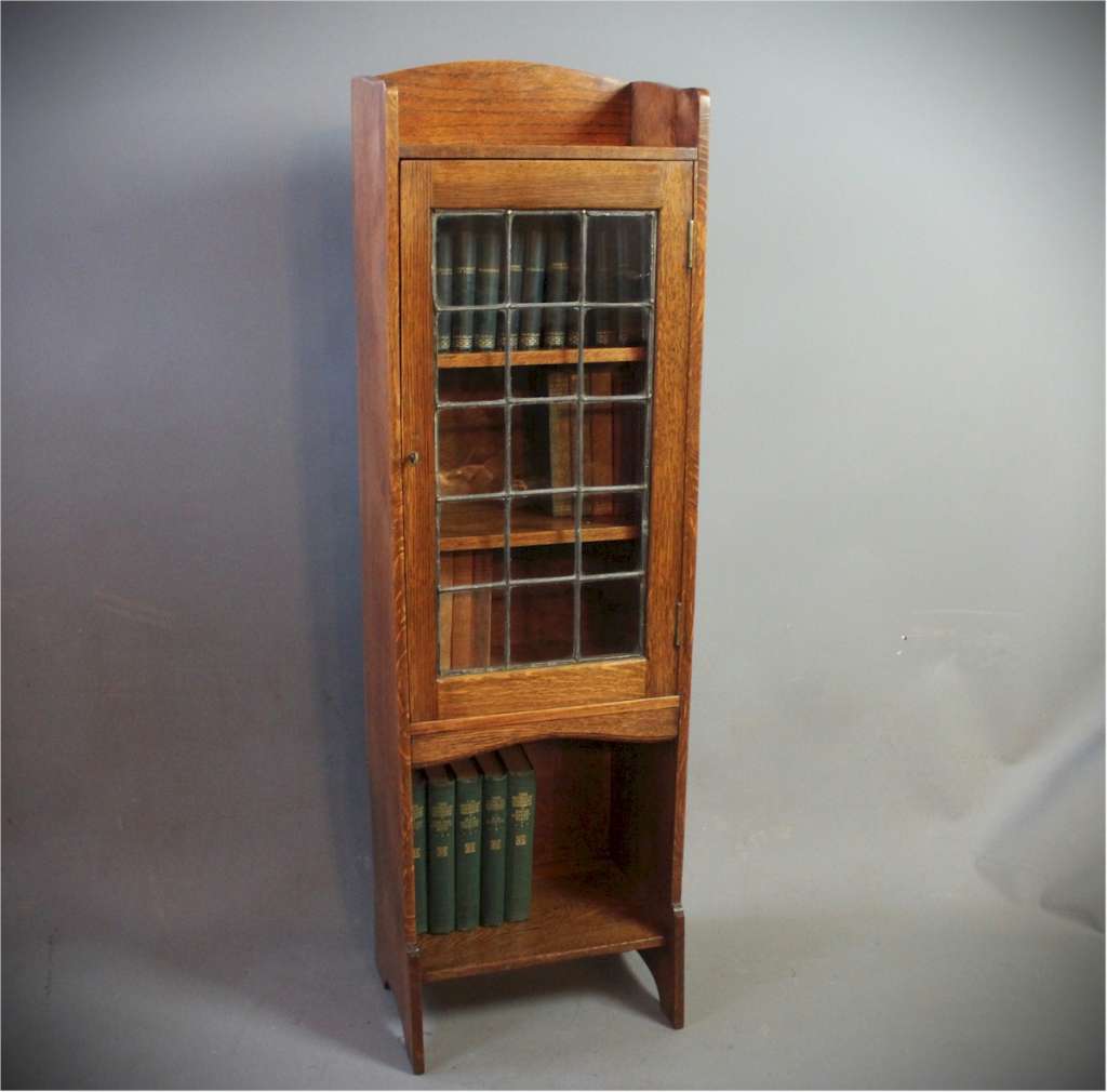 Arts and crafts glazed bookcase by Liberty & Co.