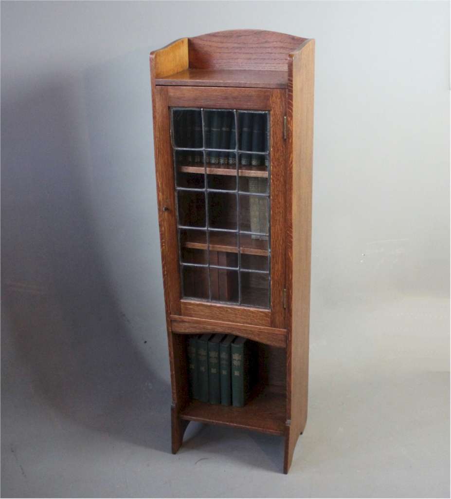 Arts and crafts glazed bookcase by Liberty & Co.