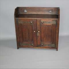 Arts and Crafts oak wall cabinet. c1900