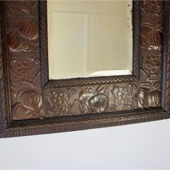 Aesthetic Movement wood and copper framed mirror.