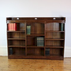 Liberty & Co Arts and Crafts oak open bookcase with pierced heart cut outs