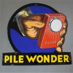 Pile Wonder enamel advertising sign