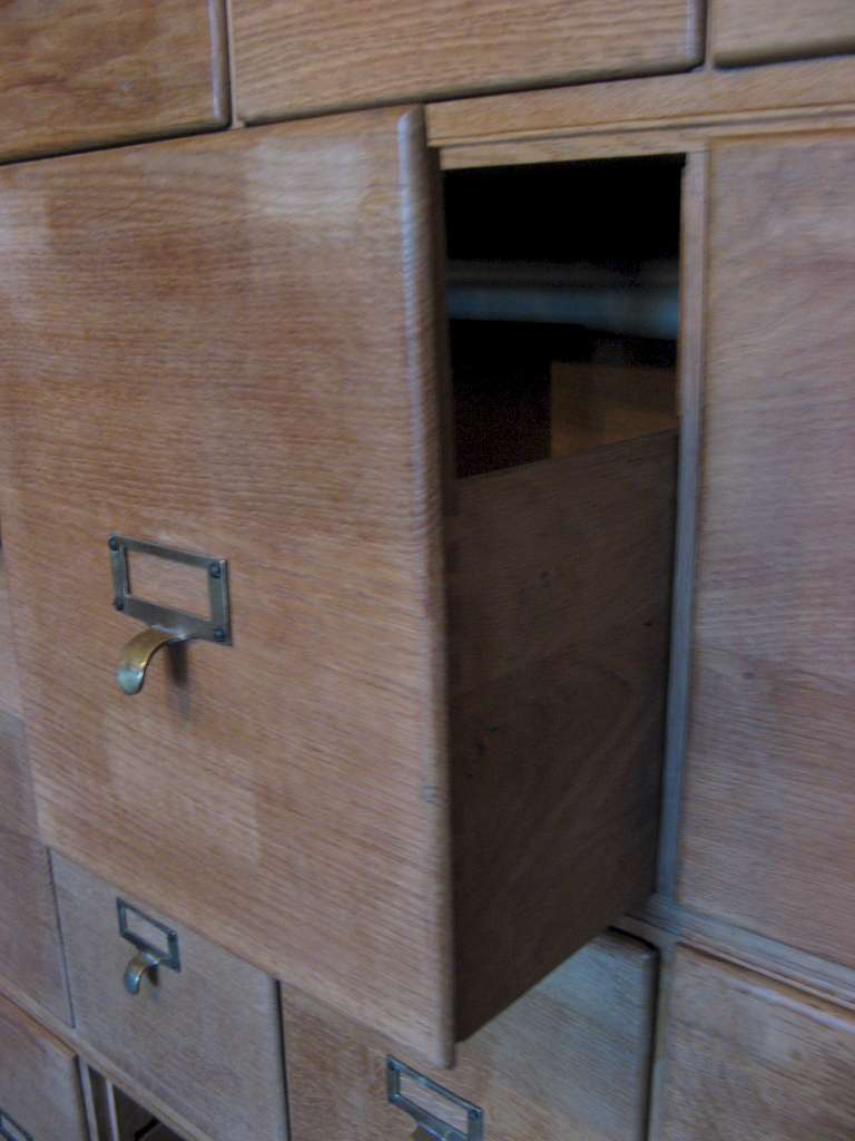 Oak sectional filing cabinet with brass pulls