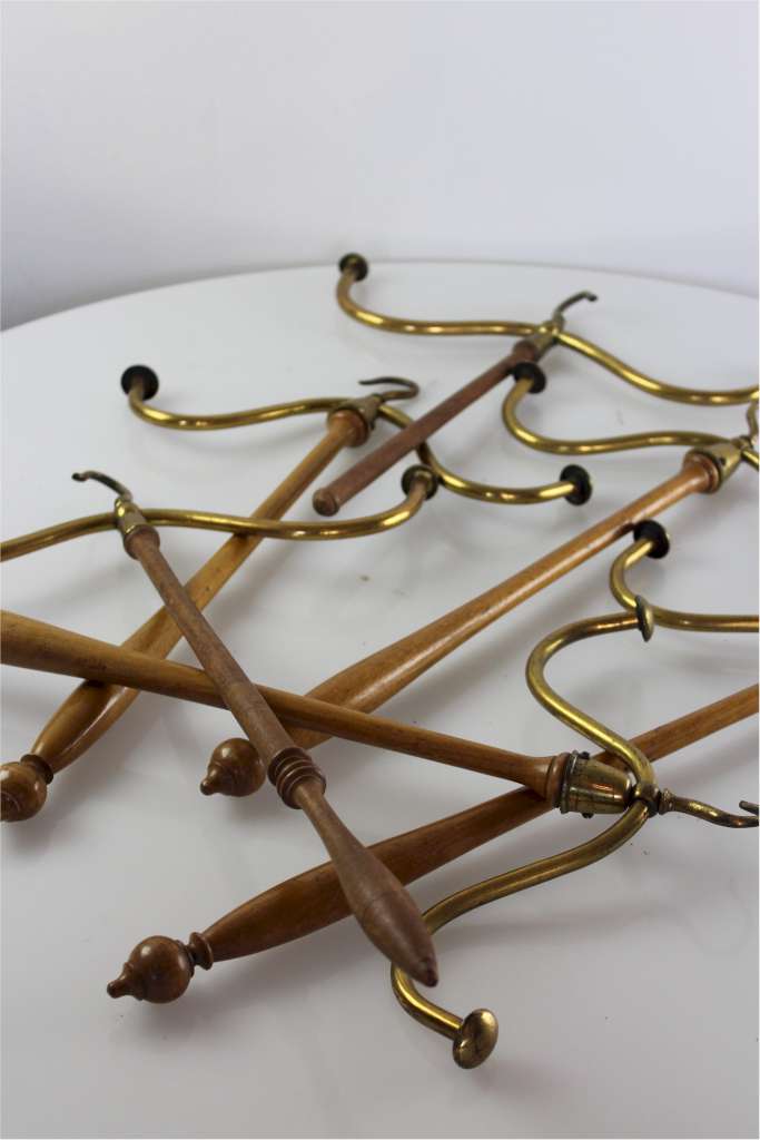 Set of four brass and beech barristers wig and gown hangers
