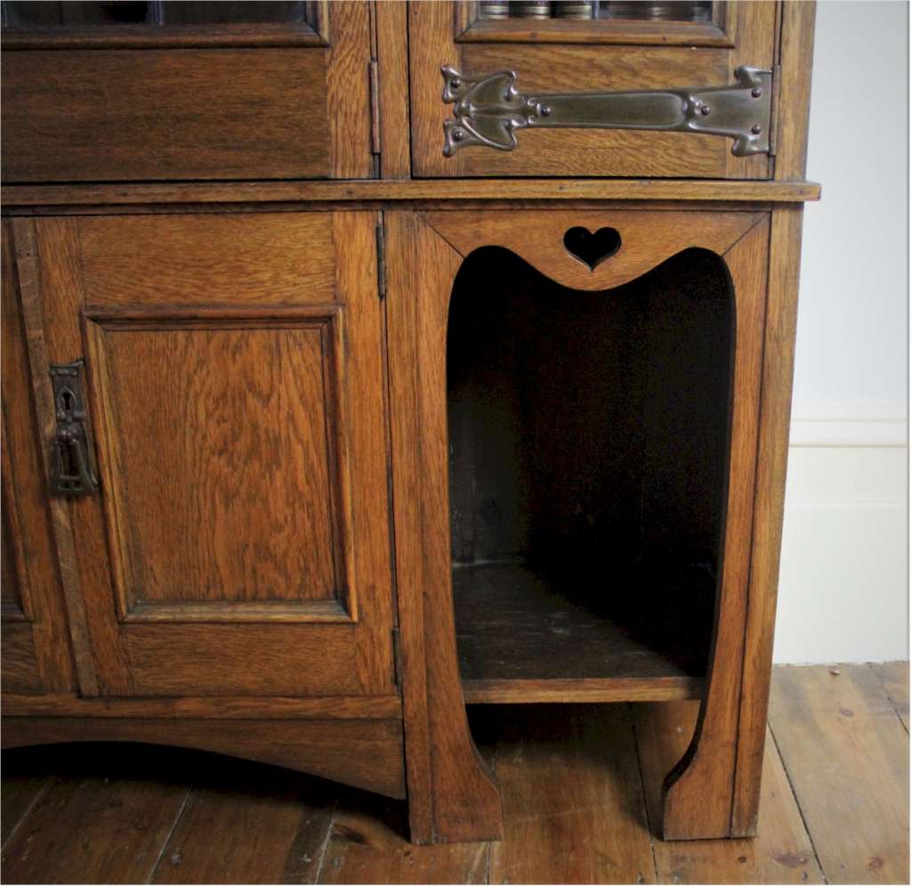 Arts and Crafts glazed bookcase with hearts