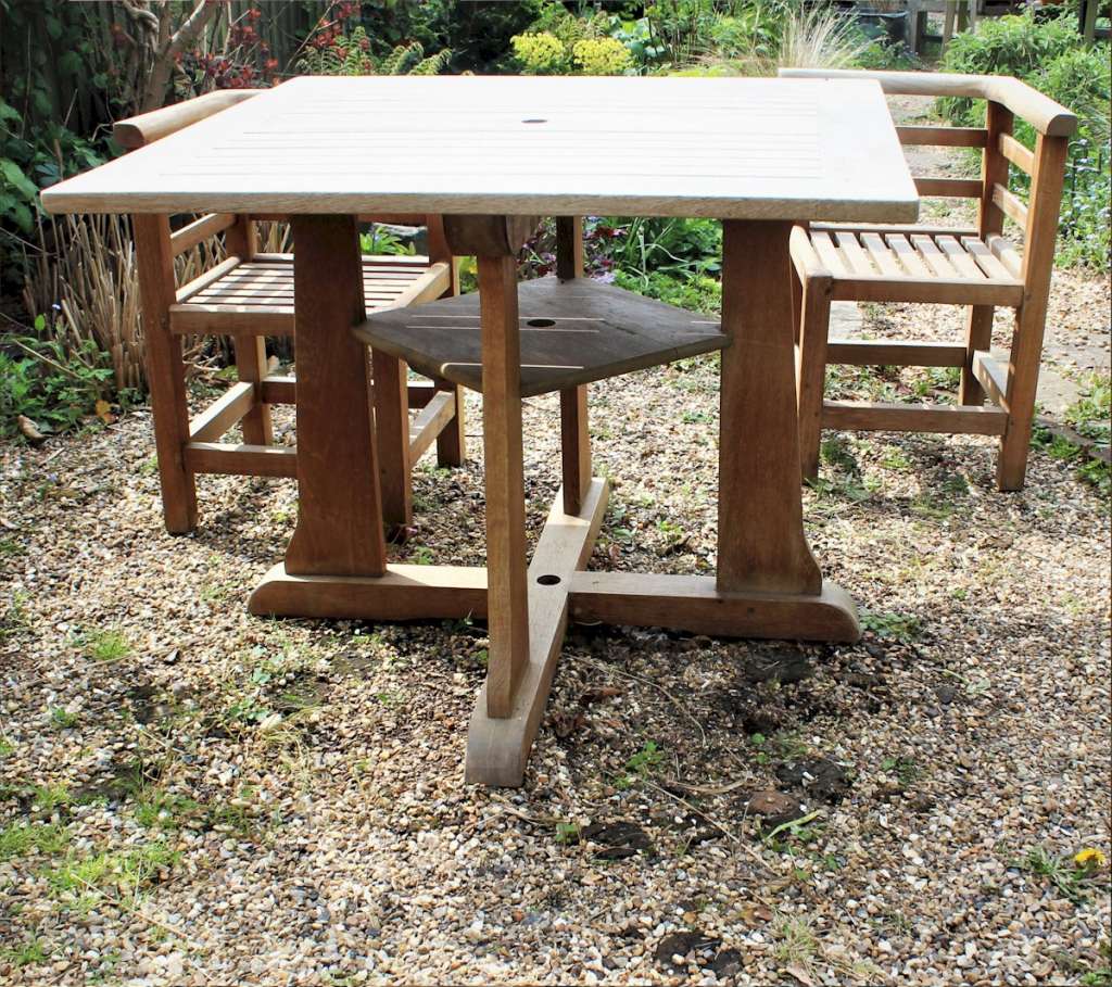 Teak garden table and four corner chairs