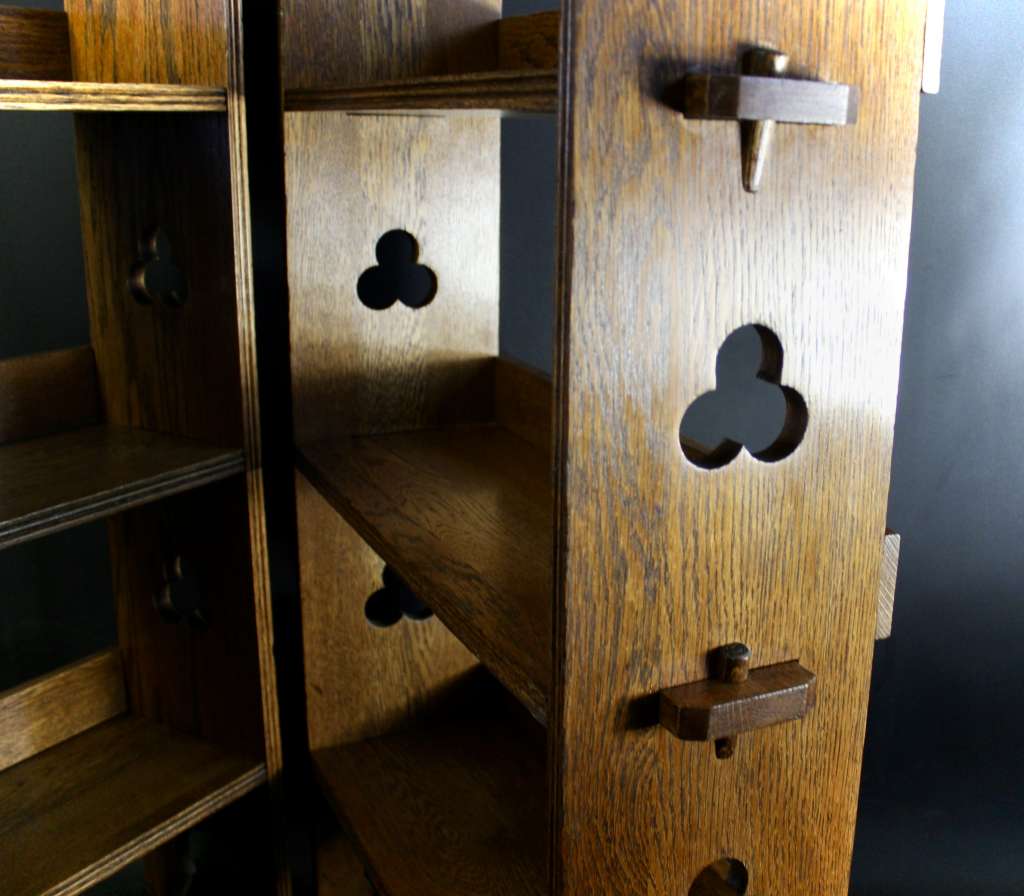 A Pair of Arts and Crafts oak open bookshelves, 