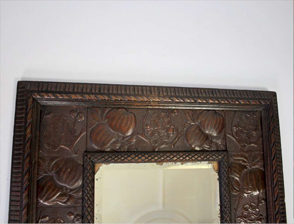 Aesthetic Movement wood and copper framed mirror.