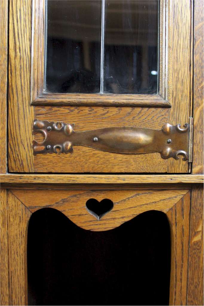 Arts and Crafts oak glazed bookcase with Motto,