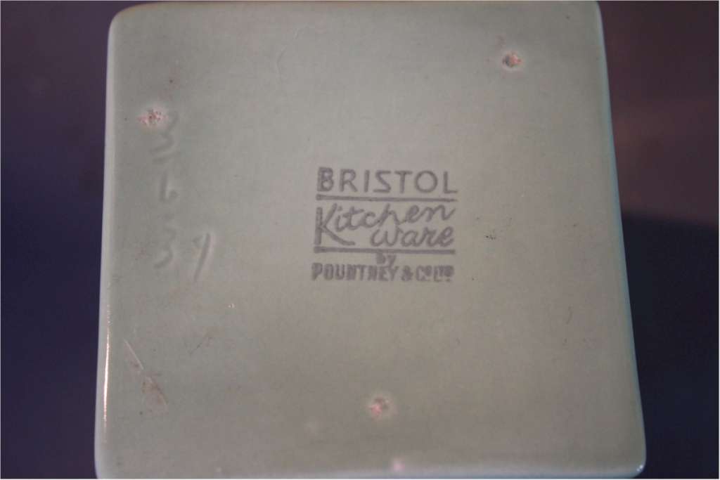 Part collection of Bristol Ware green kitchen containers.