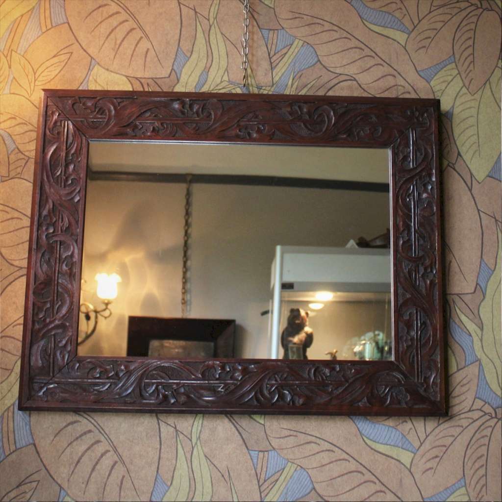 Arts and crafts carved mirror in mahogany