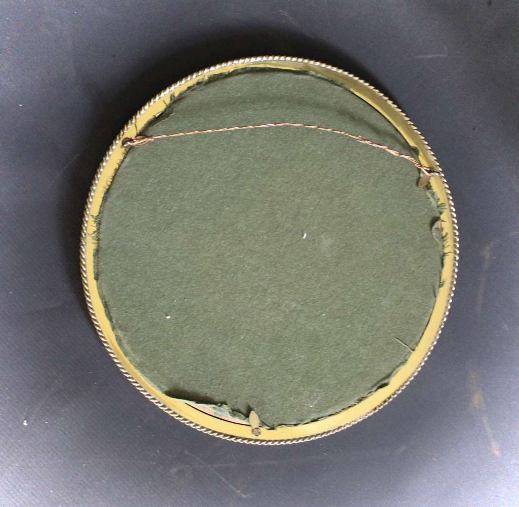 Circular brass ribbed wall mirror