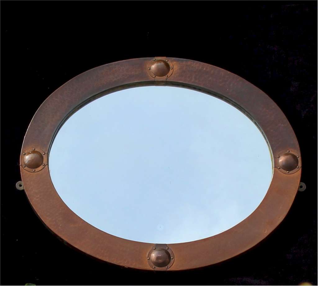 Arts and Crafts oval copper mirror.