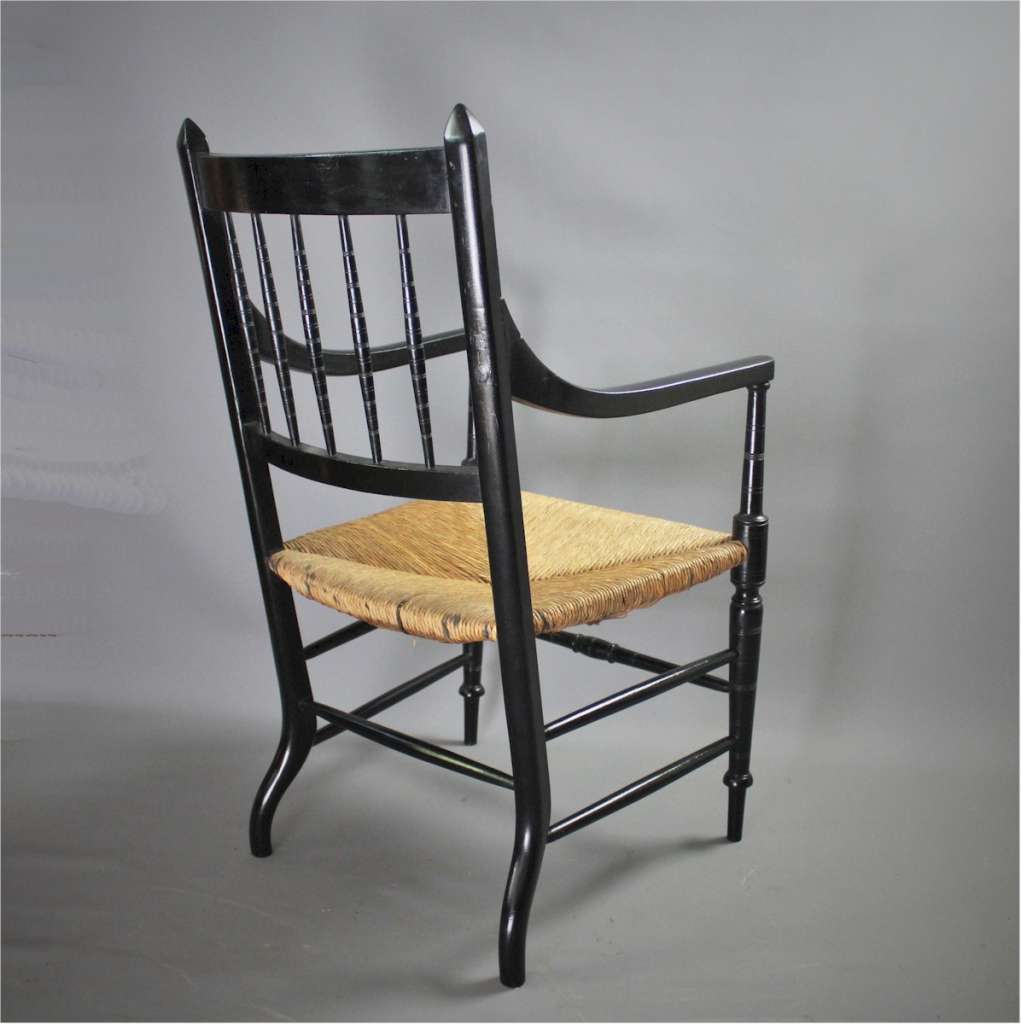 Aesthetic Ebonised rushed elbow chair