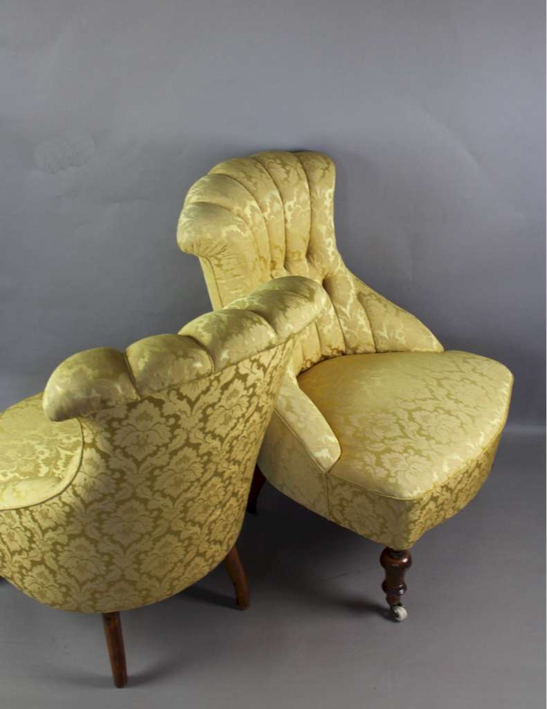 Pair of Victorian button backed armchairs in gold patterned fabric