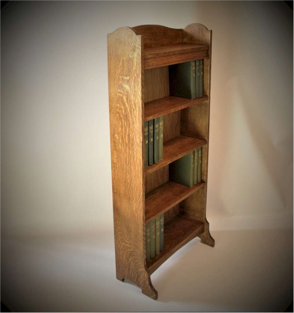 Arts and Crafts open bookshelf in oak by Heal and Son