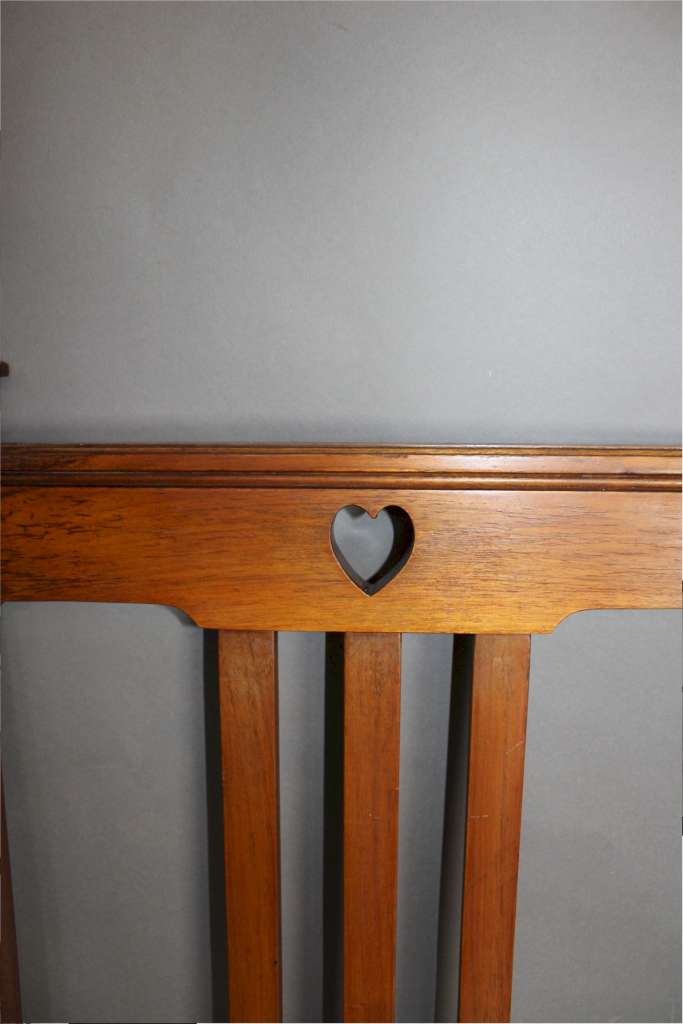 Arts and Crafts double bed with pierced heart cut-outs