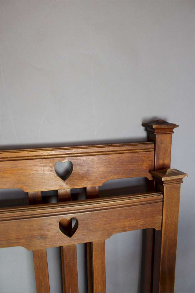 Arts and Crafts double bed with pierced heart cut-outs
