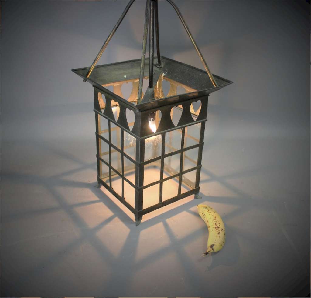 arts and crafts brass lantern with Voysey style pierced hearts