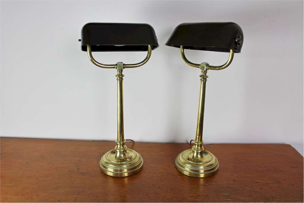 Pair of good quality Edwardian bankers lamps in brass with Bakelite shades.