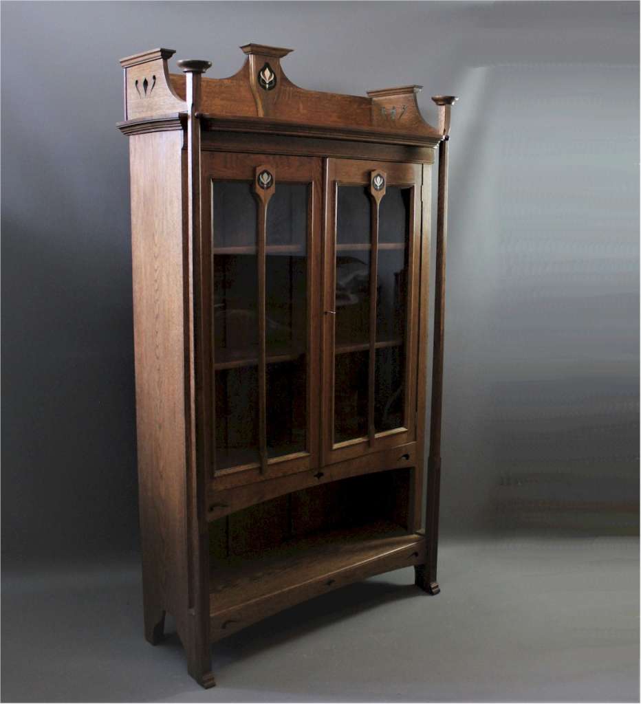 Arts and Crafts oak bookcase with ebony and pewter inlay.