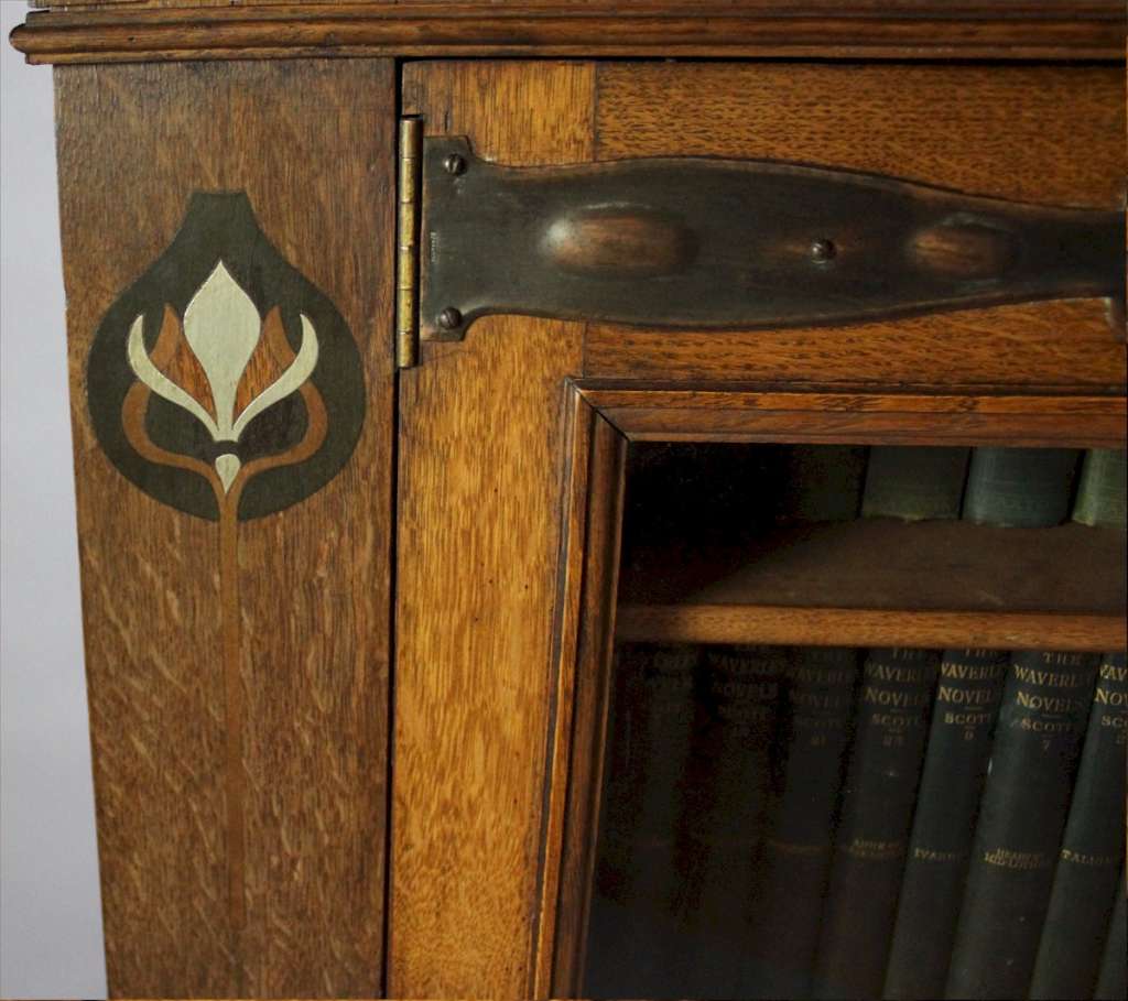 Pewter and ebony inlaid arts and crafts bookcase