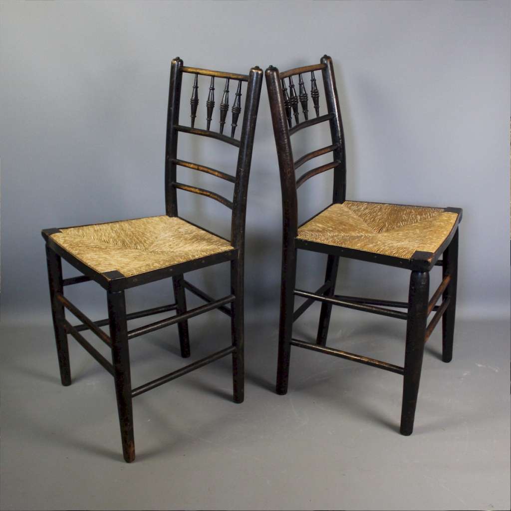 Sussex chairs near pair by Morris & Co