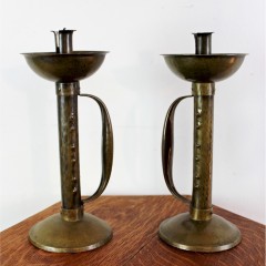 Pair of arts and crafts movement brass candlesticks