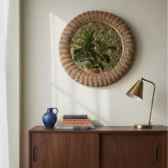 Mid-Century circular wicker mirror in the style of Albini.