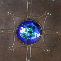 Arts and Crafts copper casket with enamelled roundel by A E Jones