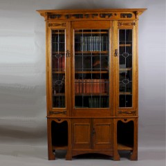 Arts and Crafts oak glazed bookcase with Motto,