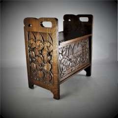 Arts and crafts carved oak slipper box