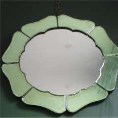 An Art Deco green mirror