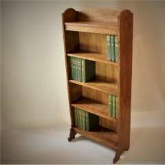 Arts and Crafts open bookshelf in oak by Heal and Son