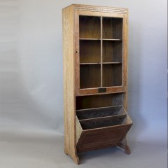 1930's limed oak glazed bookcase with interesting fall front magazine rack. Probably by Heals