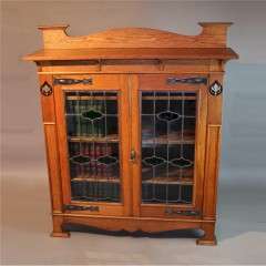 Arts and Crafts oak inlaid and glazed bookcase