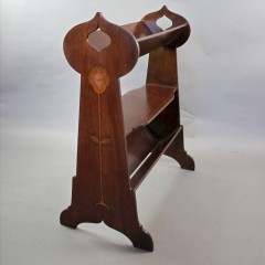 Art Nouveau mahogany inlaid book trough with pierced cut-out