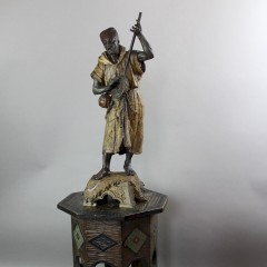 Large spelter figure of an Arab Bedouin playing the mandolin