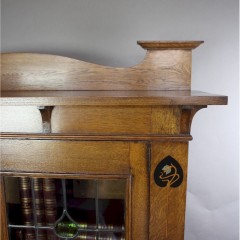 Arts and Crafts oak bookcase with pewter and ebony inlay
